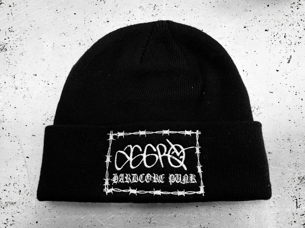 a black cuffed beanie that says Aggro Hardcore Punk in white thread