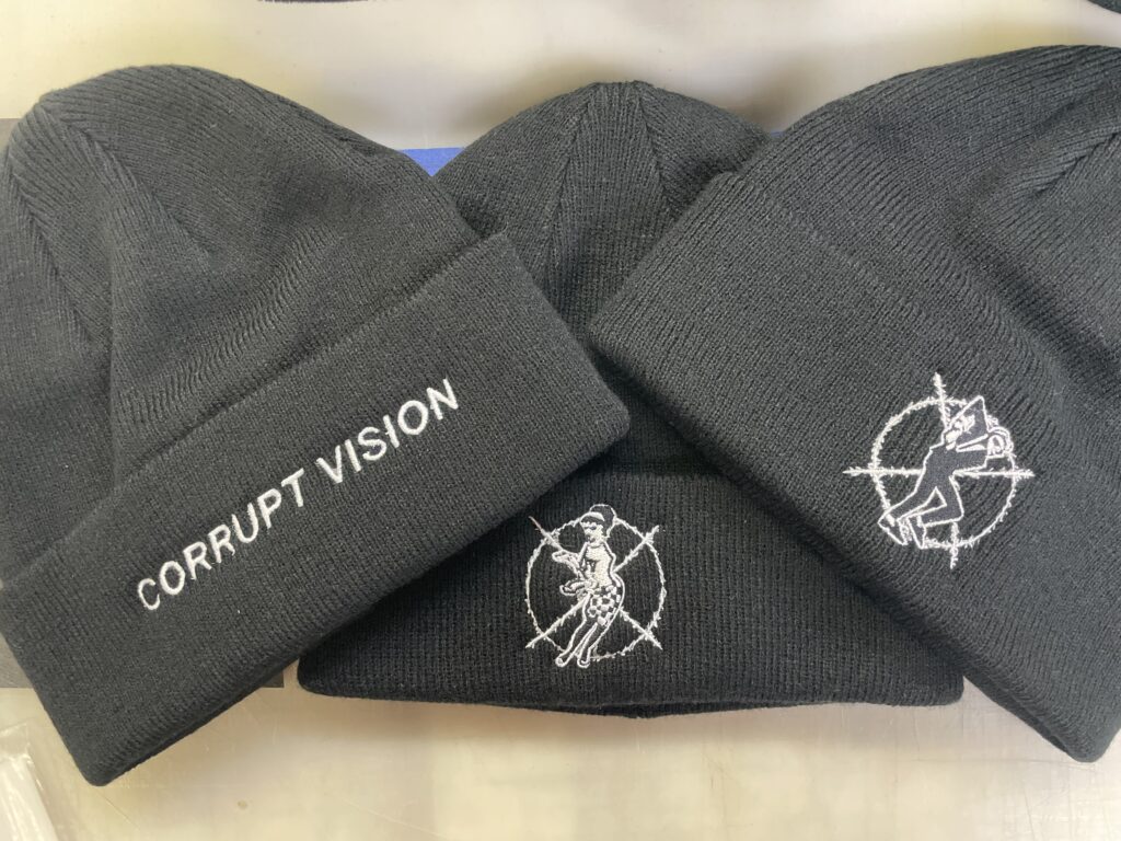Trio of cuffed beanies with embroidered band logos